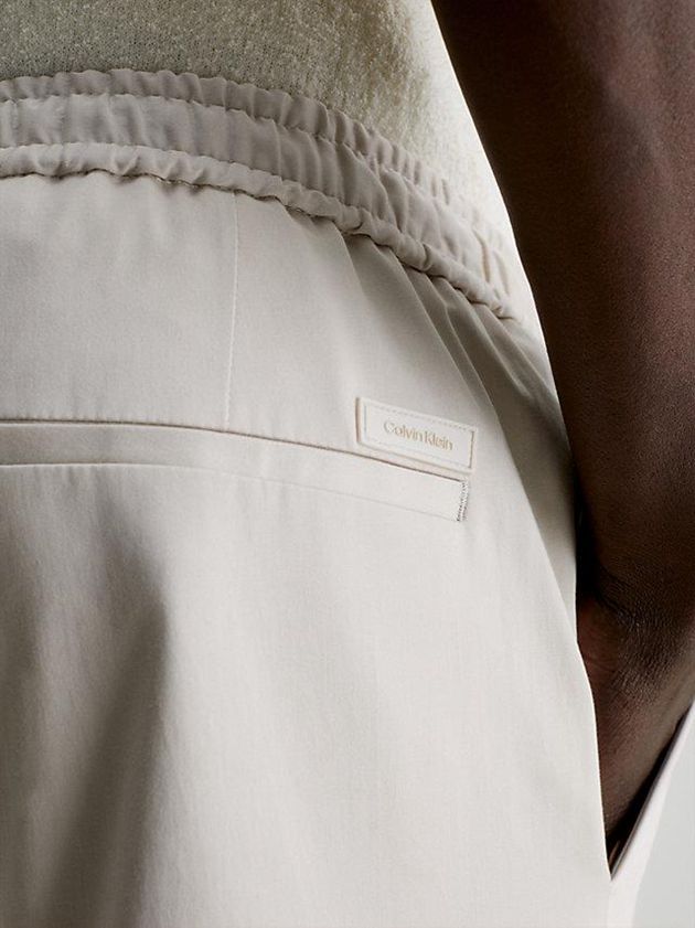White Calvin Klein Slim Sateen Stretch Men Joggers | OMEX-17230